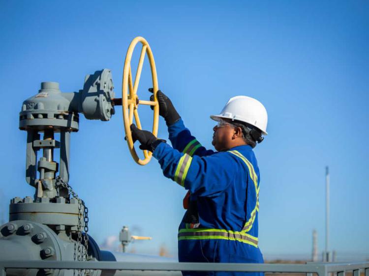 Man controlling valve